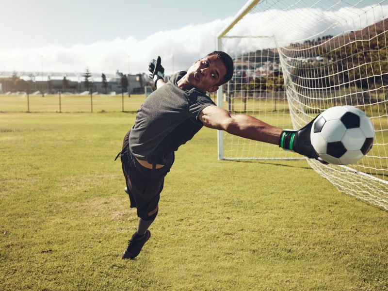 soccer-sports-and-goalkeeper-training-on-a-field